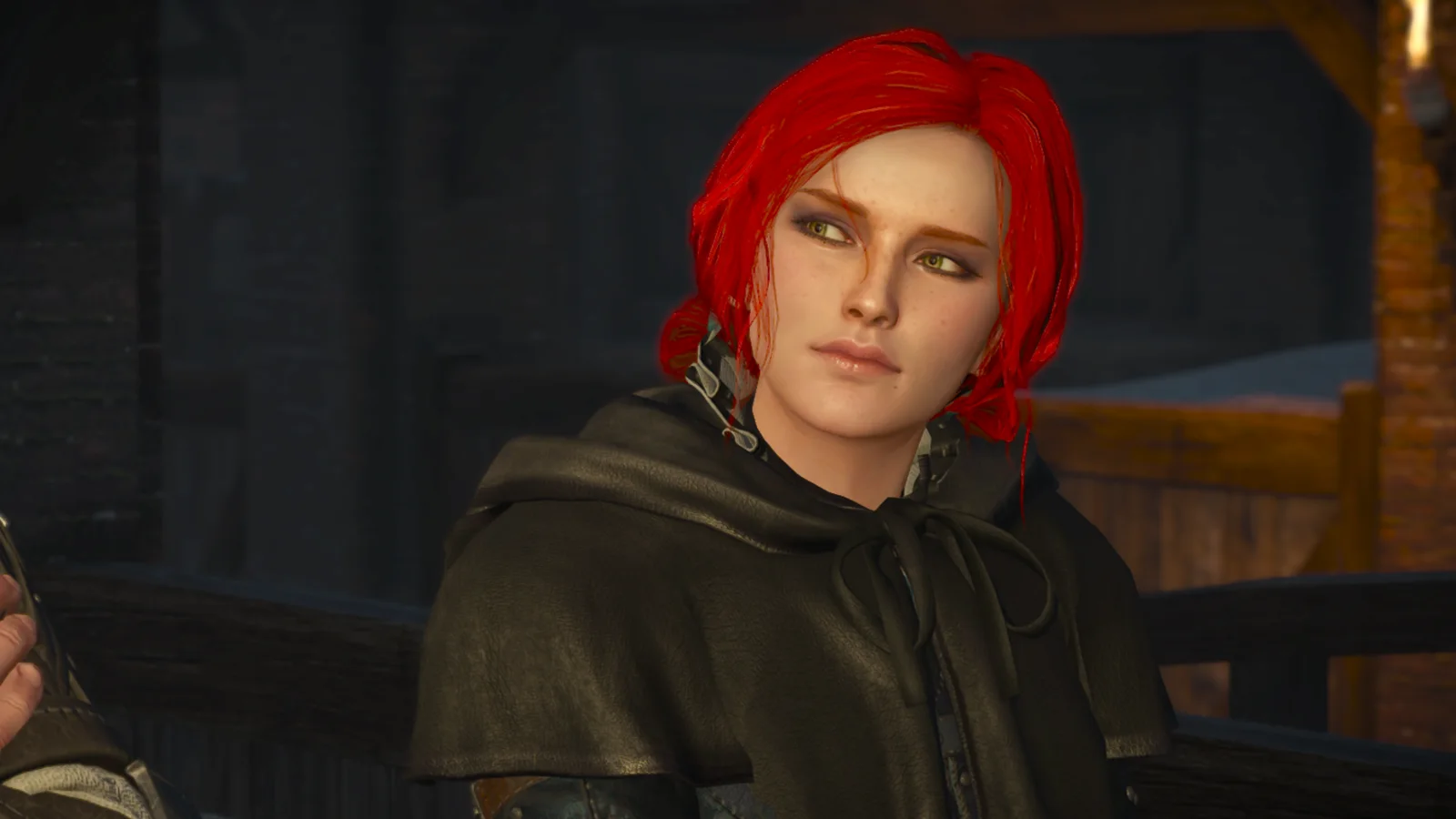 Red hair, dark hooded cloak